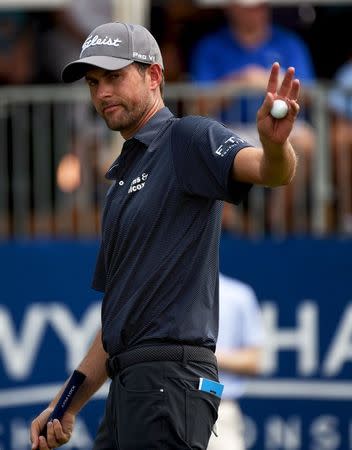 Aug 17, 2017; Greensboro, NC, USA; Webb Simpson gestures to the crowd on the ninth hole during the first round of the Wyndham Championship golf tournament at Sedgefield Country Club. Mandatory Credit: Rob Kinnan-USA TODAY Sports