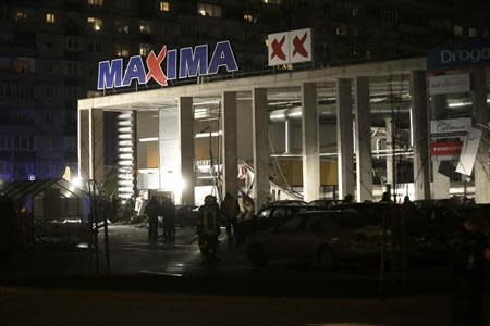 A general view shows a store with a collapsed roof in Riga November 21, 2013. REUTERS/Ints Kalnins