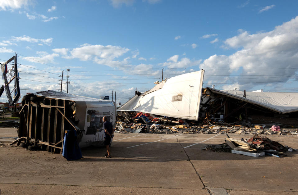 A strip mall is damaged by a tornado in Katy, Texas (Chen Chen / Zuma Press )