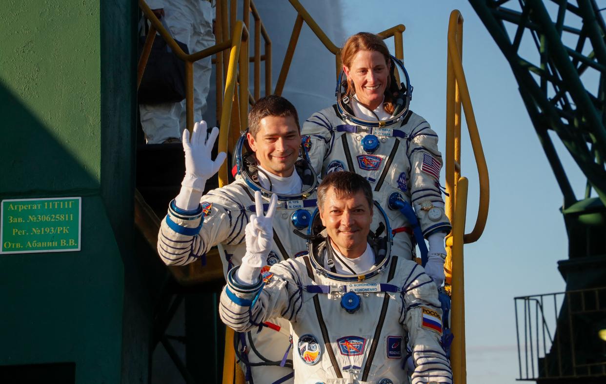 (bottom-top) Russian Roscosmos cosmonauts Oleg Kononenko and Nikolai Chub and US NASA astronaut Loral O'Hara, members of the International Space Station (ISS) Expedition 70-71 main crew, board the Soyuz MS-24 spacecraft ahead of the launch in the Russian leased Baikonur cosmodrome in Kazakhstan on September 15, 2023. (Maxim Shipenklov/Pool/AFP via Getty Images)