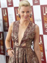 The "Hunger Games" actress in a very daring metallic copper style cut-out plunge dress at the LAFF premiere of 'People Like Us'