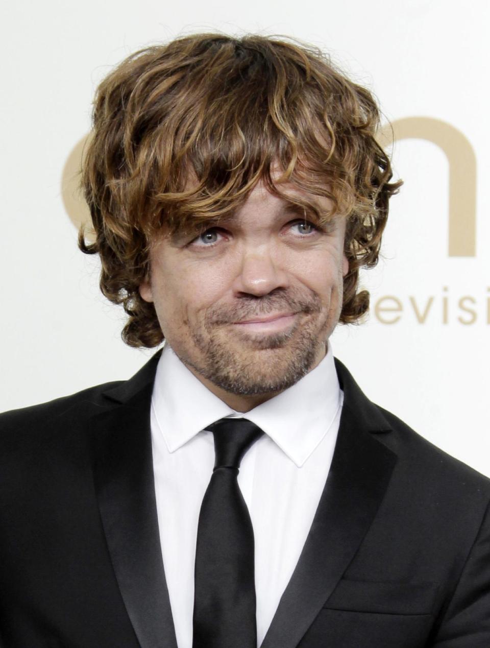 FILE - In this Sept. 18, 2011 file photo, Peter Dinklage from the HBO series "Game of Thrones" poses backstage at the 63rd Primetime Emmy Awards in Los Angeles. Dinklage won the Emmy for best supporting actor in a drama series for his role as Tyrion Lannister. Dinklage, 43, who has been a vegetarian since he was 16, is the national spokesman for Farm Sanctuary's annual Walk for Farm Animals. He has filmed a YouTube video and will spend his off season promoting the group's campaign to change the way society views and treats farm animals. (AP Photo/Jae Hong, file)