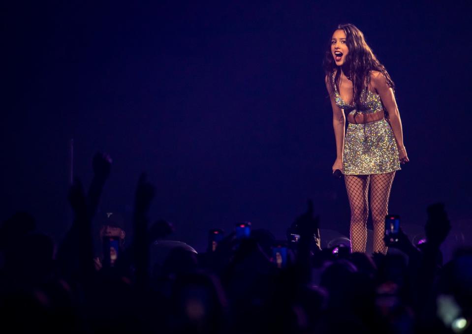 Olivia Rodrigo talks with the crowd after finishing "ballad of a homeschooled girl" during the first stop on the "Guts" tour at Acrisure Arena in Palm Desert, Calif., Friday, Feb. 23, 2024.