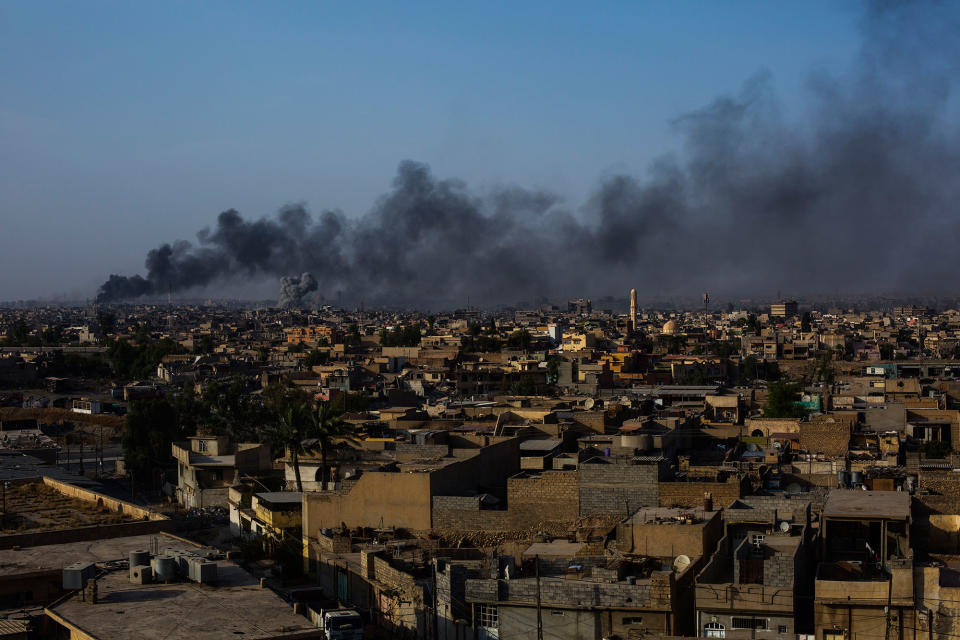 <p>A view of the old city of Mosul on fire after an ISIS counterattack along the northern edge of Mosul’s Old City neighborhood. July 7, 2017. Mosul. Iraq. (Photograph by Diego Ibarra Sánchez / MeMo) </p>