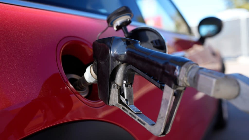 A motorist fills up the fuel tank of a vehicle at a Shell station in Englewood, Colorado. A big explanation for the recent decline in gas prices is seasonality — with prices at the pump almost always easing at this time of year. (Photo: David Zalubowski/AP)