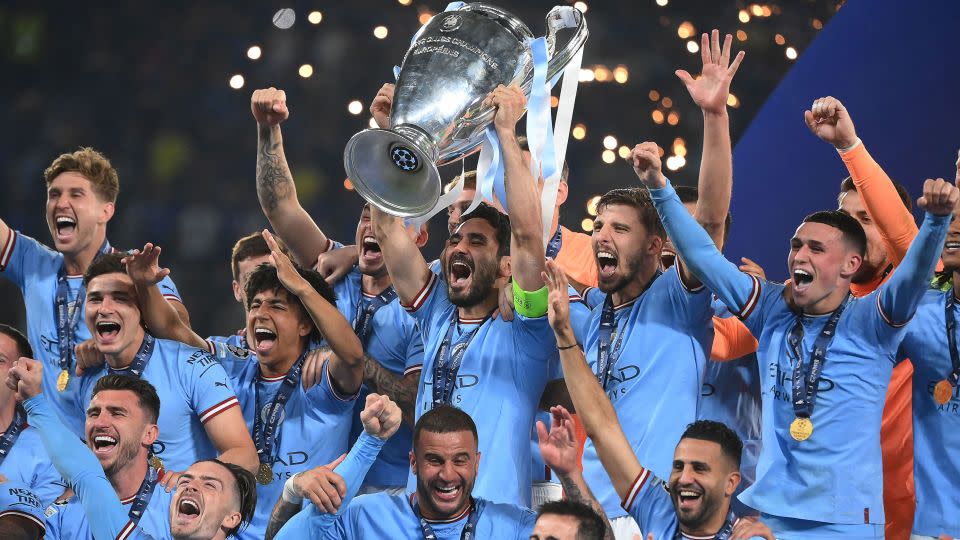 İlkay Gündoğan lifts the Champions League trophy after Manchester City beats Inter Milan in the final. - Franck Fife/AFP/Getty Images