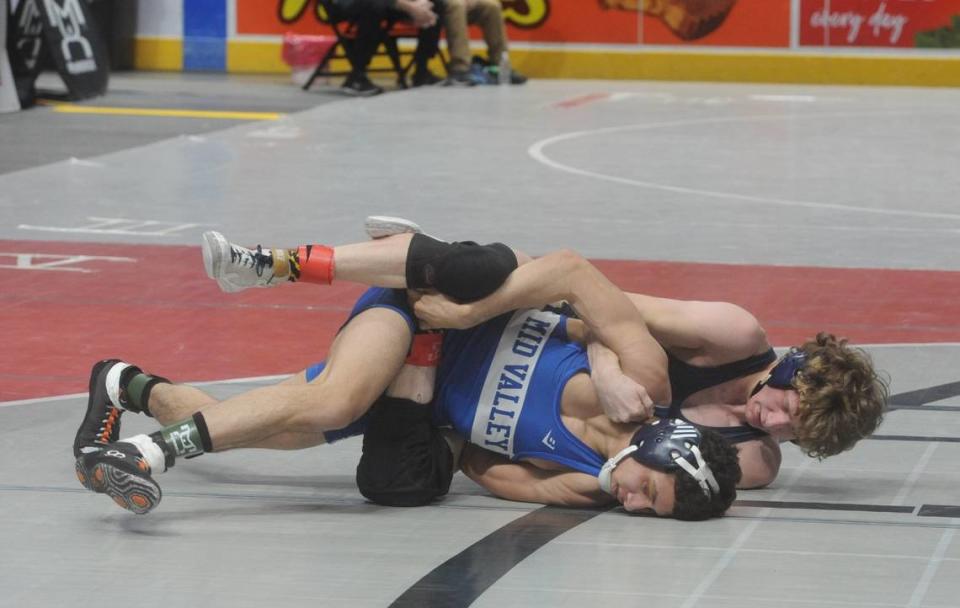 Bald Eagle Area’s Lucas Fye looks for nearfall points on Mid Valley’s Matthew Almedina in their 121-pound first round match of the PIAA Class 2A Championships on Thursday, March 9, 2023 at the Giant Center in Hershey. Fye beat Almedina, 6-1.