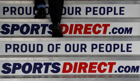 FILE PHOTO: A man arrives for Sports Direct AGM at their headquarters in Shirebrook, Britain September 6, 2017. REUTERS/Darren Staples