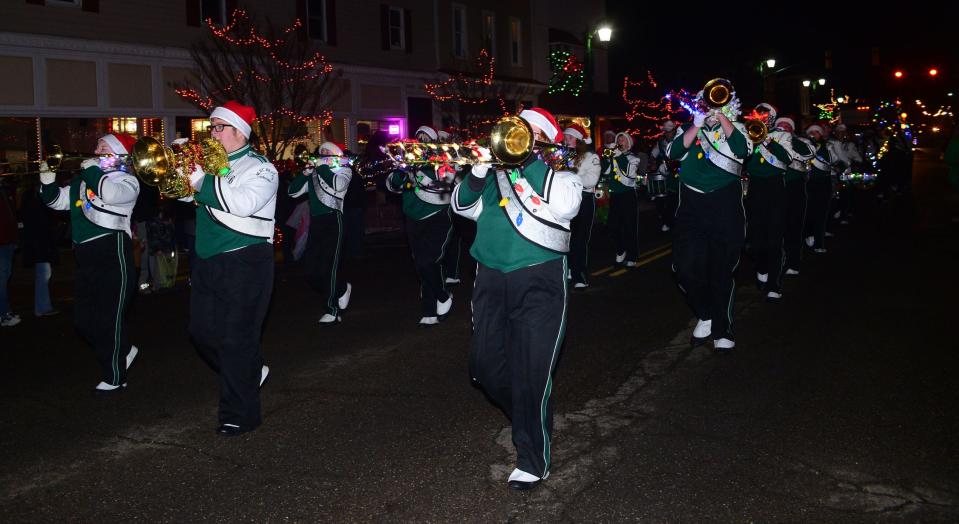 West Branch High School's Marching Band plays holiday songs as it marches down 15th Street during Sebring Village's annual Christmas parade on Saturday, Dec. 2, 2023.