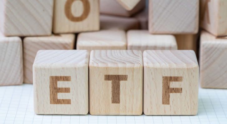 Three wood blocks spelling out "ETF". representing best etfs