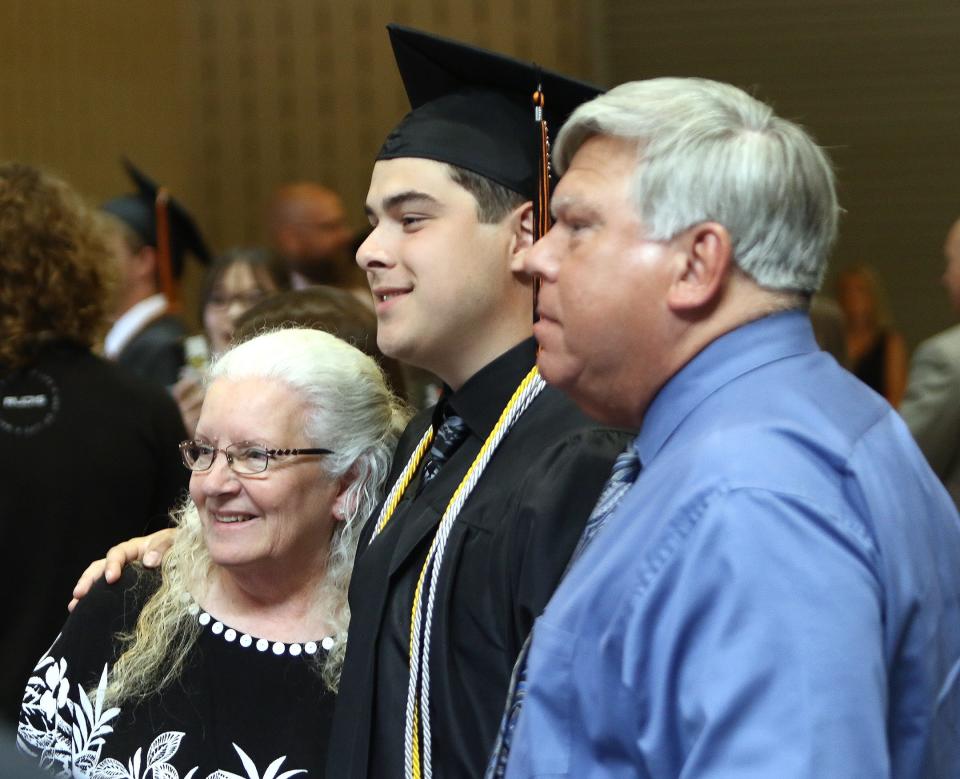 A Marlington High School graduate poses for a photo Sunday, June 5, 2022, after commencement at Canton Memorial Civic Center.