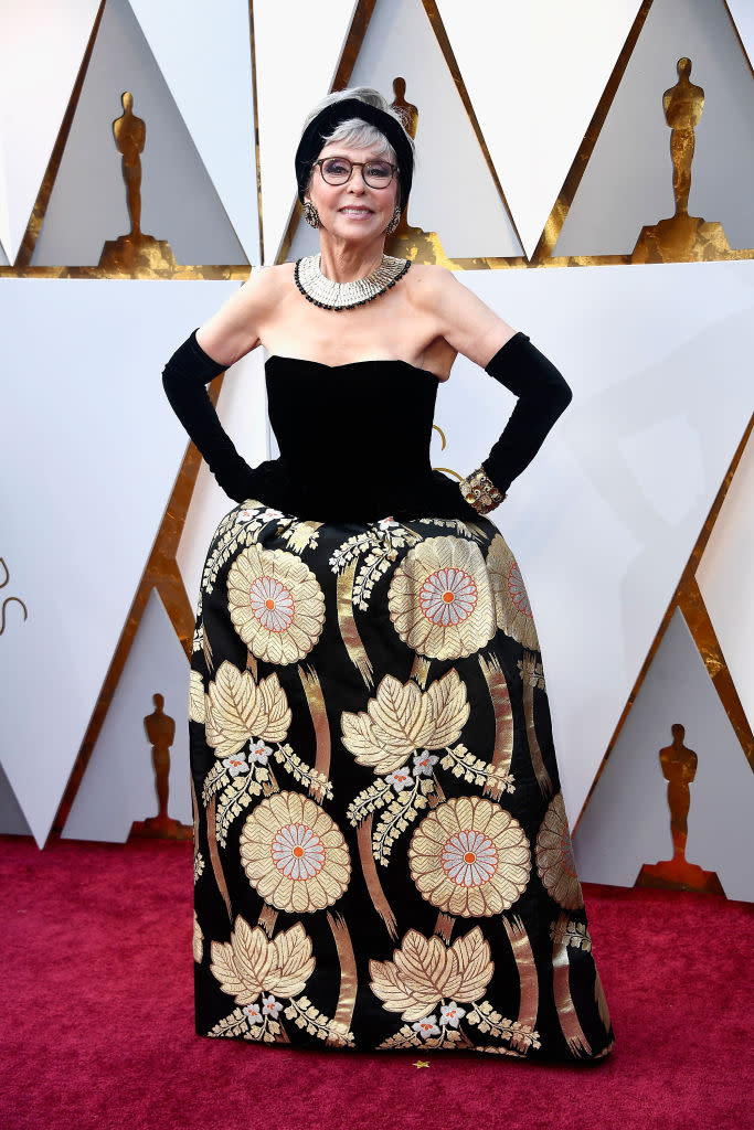 <p>Rita Moreno, 86, chose a vintage gown with <a rel="nofollow" href="https://www.yahoo.com/lifestyle/rita-moreno-rewears-oscars-gown-235700975.html" data-ylk="slk:special meaning;elm:context_link;itc:0;sec:content-canvas;outcm:mb_qualified_link;_E:mb_qualified_link;ct:story;" class="link  yahoo-link">special meaning</a> for her night at the 2018 Academy Awards. The gown is the very same one that she wore to the Oscars 56 years ago, when she won Best Actress in a Supporting Role in 1961’s <i>West Side Story</i>. “I would think it would tarnish!” Moreno told Ryan Seacrest on the red carpet. But no, the dress was still golden on the radiant star. (Photo: Getty Images) </p>