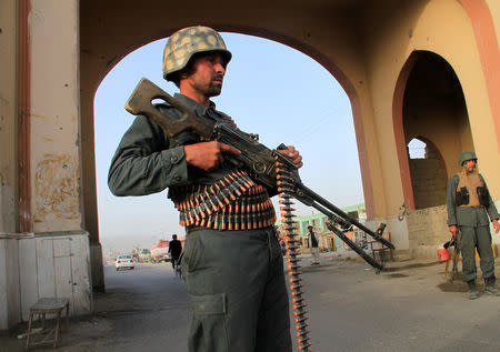 An Afghan policeman keeps watch at a check point in Ghazni city, Afghanistan September 16, 2018. Picture taken September 16, 2018. REUTERS/Mustafa Andaleb