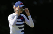 Nelly Korda, of the United States, sets her sunglasses on the 17th hole during the second round of the women's golf event at the 2020 Summer Olympics, Thursday, Aug. 5, 2021, at the Kasumigaseki Country Club in Kawagoe, Japan. (AP Photo/Andy Wong)