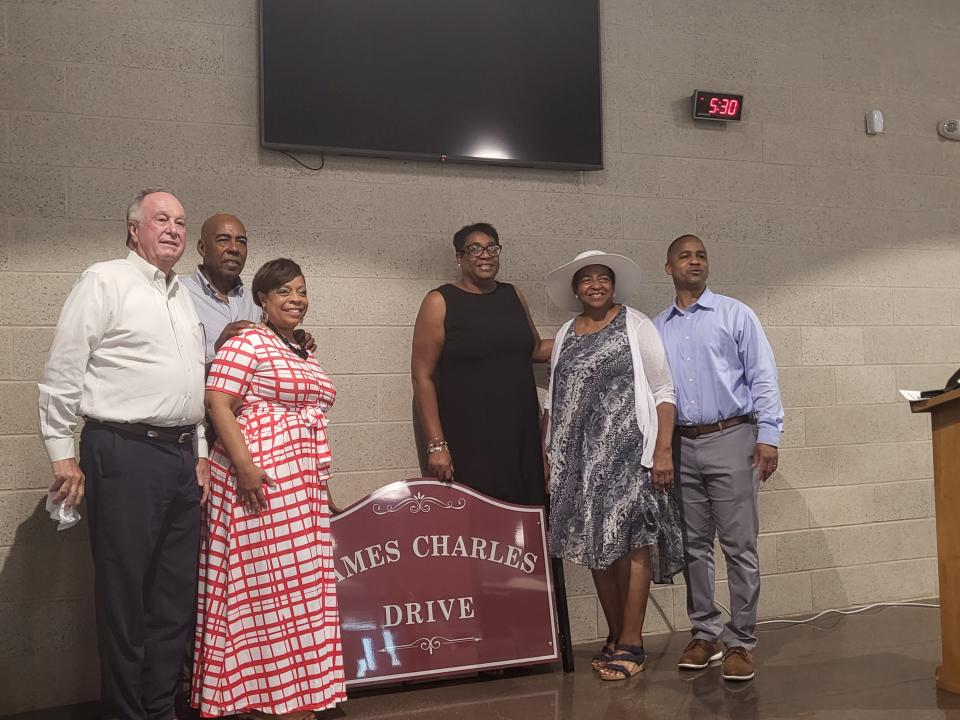 Family and friends gather around the sign that will mark a street on the Southdown Elementary campus named after former educator James Charles on Wednesday, June 29, 2022. They are, from left, Terrebonne schools Superintendent Philip Martin, Leroy Charles, Tanya Charles, Arlanda Williams, Joyce Charles Bolden and Jerome Robinson.