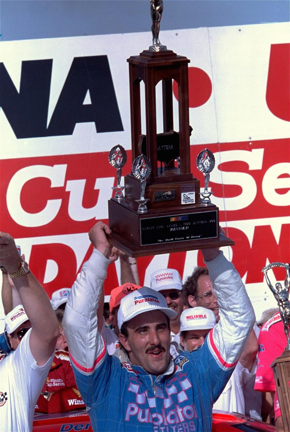 Derrike Cope improbably emerged the winner of the 1990 Daytona 500 after Dale Earnhardt shredded a right rear tire on the final lap.