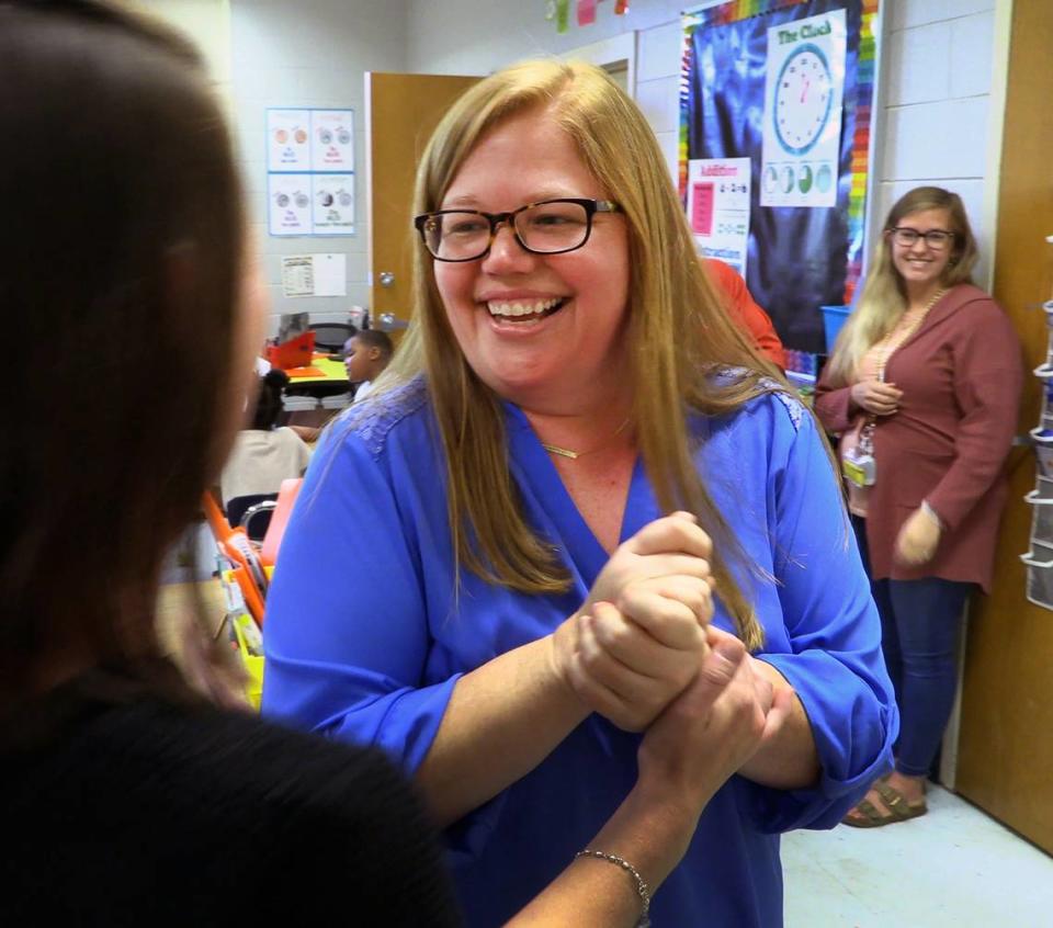 Nicole Radney, who teaches second grade at Mathews Elementary School in Columbus, center, was notified in her classroom Friday morning that she is one of three finalists for Muscogee County School District 2023 Teacher of the Year. 04/14/2023