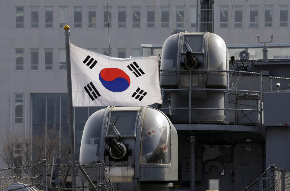 A South Korean national flag flutter at top of a mock of the South Korean Navy's Chamsuri patrol boat No. 357, which was sunk during the second Yeonpyeong sea battle between the two Koreas in 2002, at the Korea War Memorial Museum in Seoul, South Korea, Monday, March 3, 2014. North Korea fired two additional suspected short-range missiles into the sea Monday amid ongoing military exercises between Seoul and Washington, which the North calls a preparation for an attack, South Korean officials said. (AP Photo/Lee Jin-man)