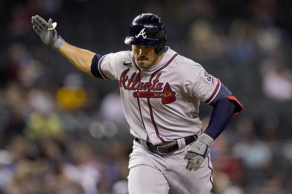 Atlanta Braves' Adam Duvall celebrates his solo home run against the Arizona Diamondbacks during the fifth inning of a baseball game, Monday, Sept. 20, 2021, in Phoenix. (AP Photo/Matt York)