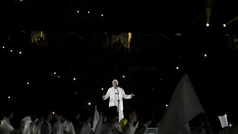 FILE - In this Sunday May 13, 2012 file photo, Placido Domingo sings after a Spanish La Liga soccer match at the Santiago Bernabeu stadium in Madrid. Two investigations into Domingo's behavior were opened in 2019 after Associated Press stories in which more than 20 women said the legendary tenor had pressured them into sexual relationships, behaved inappropriately and sometimes professionally punished those who rebuffed him. Dozens of others told the AP that they had witnessed his behavior. (AP Photo/Paul White)