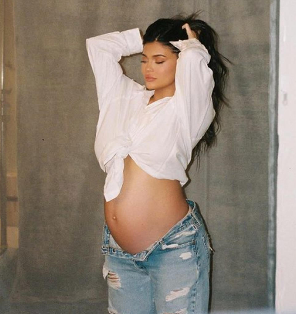 Kylie Jenner pregnant in a white shirt