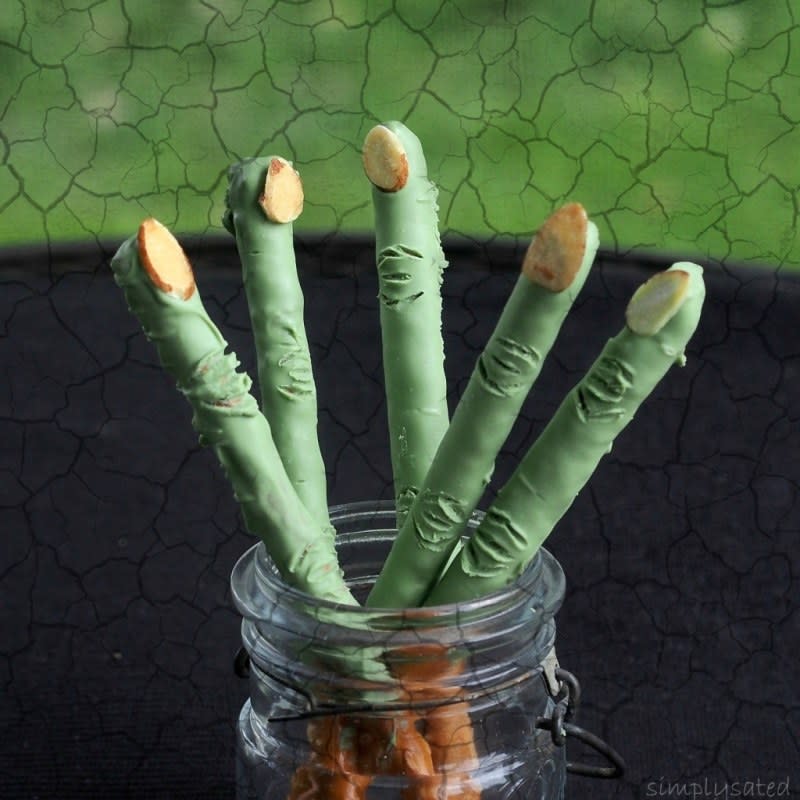 <p>With just a few ingredients turn plain pretzel rods into creepy (and fun) Halloween treats.</p><p><strong>Get the recipe: </strong><a href="https://www.simplysated.com/witch-finger-pretzels/" rel="nofollow noopener" target="_blank" data-ylk="slk:Witch Finger Pretzel;elm:context_link;itc:0;sec:content-canvas" class="link ">Witch Finger Pretzel</a></p>