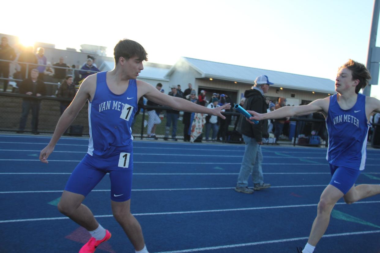 Van Meter runners exchange the baton in the distance medley relay during a home invite on Thursday, April 4, 2024.