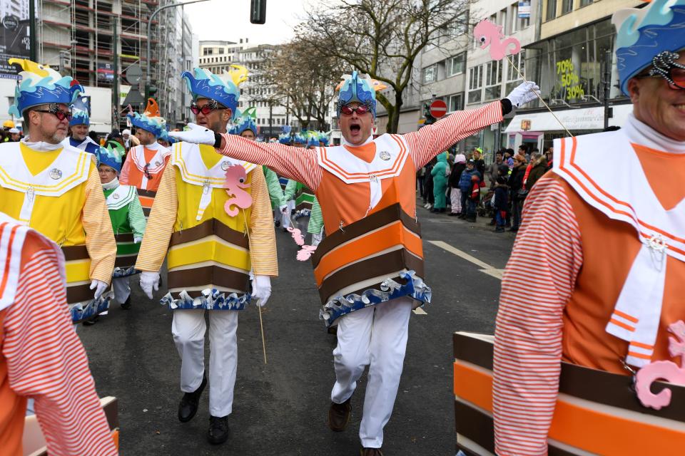 <p>Dressed-up people take part in a carnival parade on Rose Monday on Feb. 12, 2018 in Duesseldorf, western Germany. (Photo: Patrik Stollarz/Getty Images) </p>