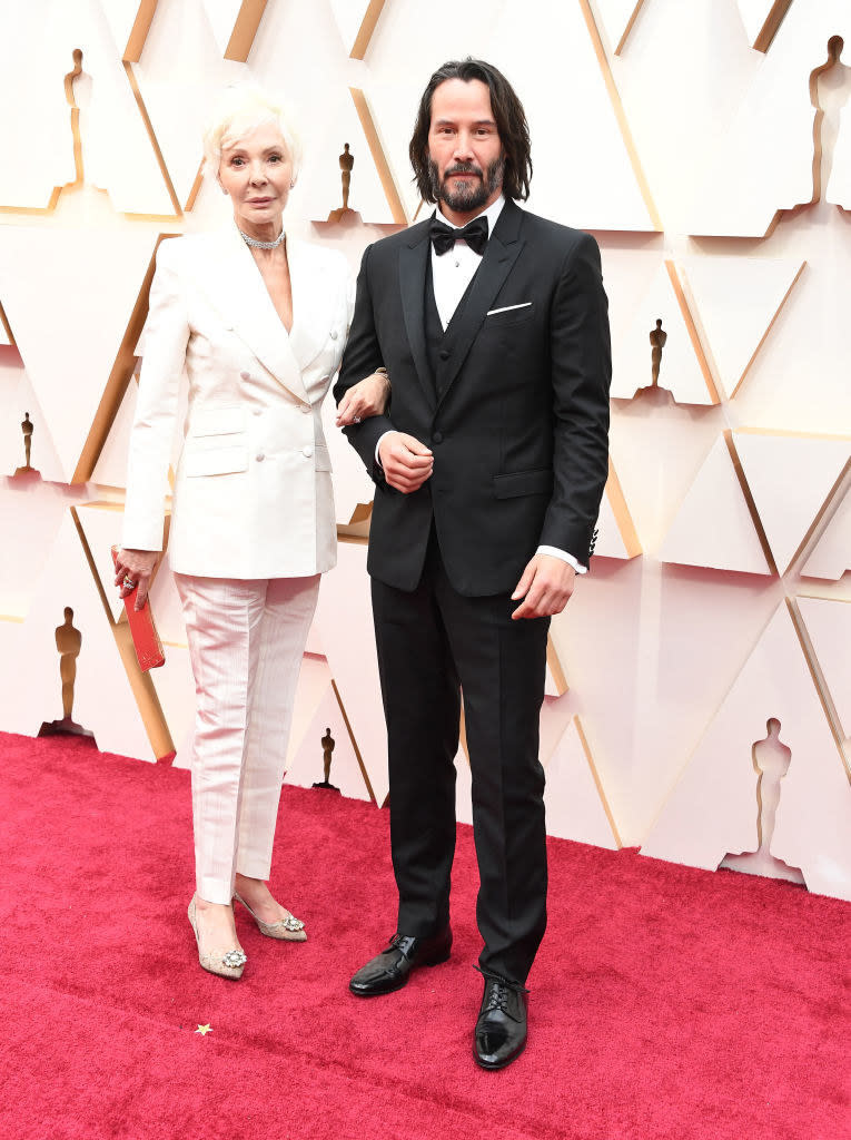 Keanu and his mom arm in arm on the red carpet
