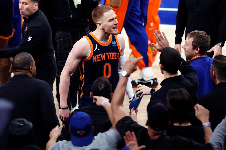 NEW YORK, NEW YORK - APRIL 22: Donte DiVincenzo #0 of the New York Knicks reacts after making a three-point shot during the second half against the Philadelphia 76ers in Game Two of the Eastern Conference First Round Playoffs at Madison Square Garden on April 22, 2024 in New York City. The Knicks won 104-101. NOTE TO USER: User expressly acknowledges and agrees that, by downloading and or using this photograph, User is consenting to the terms and conditions of the Getty Images License Agreement. (Photo by Sarah Stier/Getty Images)