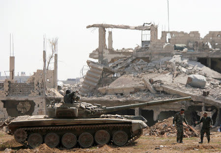 FILE PHOTO: Soldiers loyal to Syria's President Bashar al-Assad forces are deployed at al-Qadam area near Yarmouk Palestinian camp in Damascus, Syria April 29, 2018. REUTERS/ Omar Sanadiki/File Photo