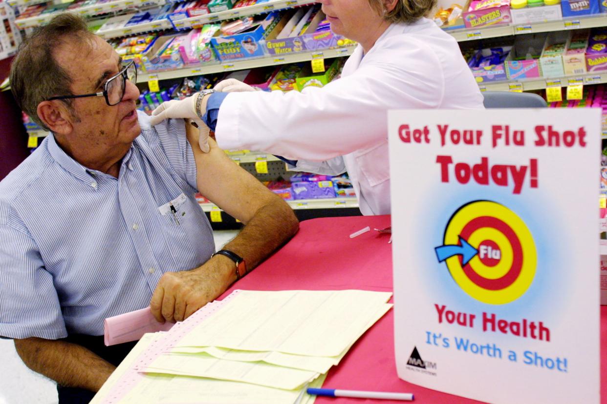 flu shot stand and promotional sign in pharmacy in miami, fl