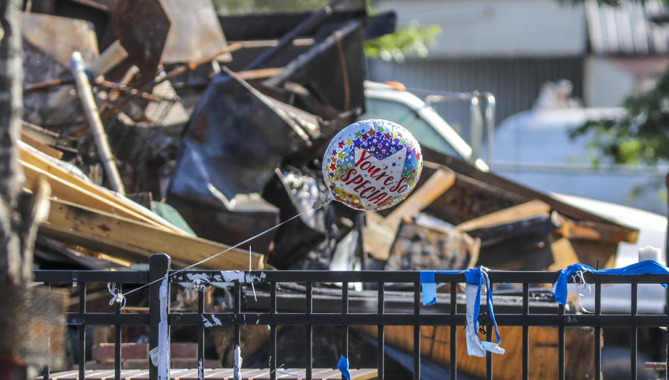 The Wendy's where Rayshard Brooks was killed by Atlanta police last month was torn down in Atlanta on Tuesday, July 14, 2020. Construction crews used an excavator to demolish the charred remains of the University Avenue restaurant. It is not clear who ordered Tuesday's demolition, which comes a little more than a week after demonstrators who had camped out at the site following Brooks' death were forced off the property. The Wendy's became ground zero for protests after Brooks was shot in the parking lot following an attempted DUI arrest in the drive-thru line June 12. The restaurant was set on fire the following day during one of those demonstrations. Garrett Rolfe, the officer who fired the deadly shots, was charged with murder and fired from the department. He is free on $500,000 bond. For weeks, protesters remained at the torched restaurant and refused to leave until demands for police reform and a memorial to Brooks' memory were met. That changed when city leaders sent officers to clear the site July 6 in response to the killing of 8-year-old Secoriea Turner, who was shot across the street from the Wendy's during a violent July 4 weekend in Atlanta. (John Spink/Atlanta Journal-Constitution via AP)