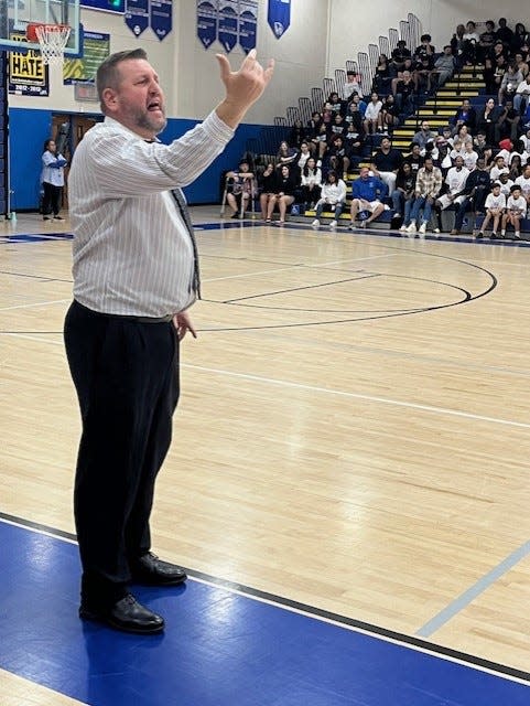 Wellington coach Matt Colin shouts instructions to his team during the Wolverines' 52-40 victory over crosstown rival Palm Beach Central on Friday night