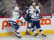 Tampa Bay Lightning's Ondrej Palat, center, celebrates his goal against the Montreal Canadiens withAlex Killorn, right, and Victor Hedman during the third period of an NHL hockey game Tuesday, Dec. 7, 2021, in Montreal. (Paul Chiasson/The Canadian Press via AP)