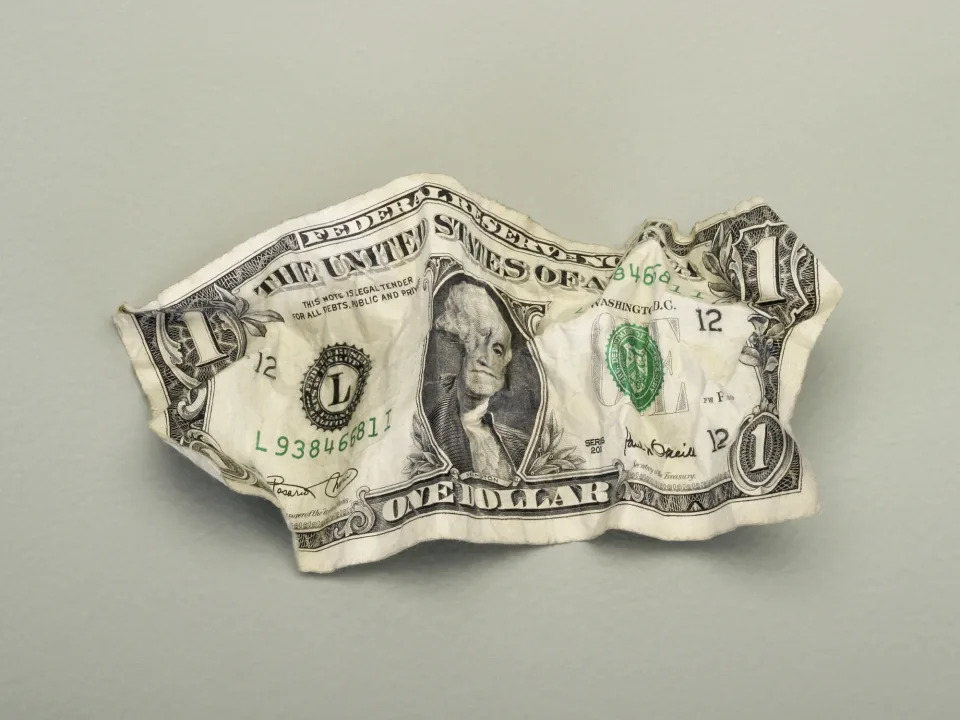 A crumbled up dollar bill.
