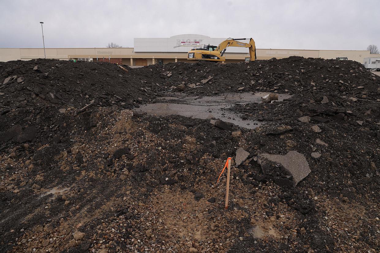 Asphalt and dirt from an old parking lot are being cleared at the former Kmart site along Lincoln Way E in Massillon. Work is being done to accommodate a new Chipotle restaurant, slated to open in mid-2022.