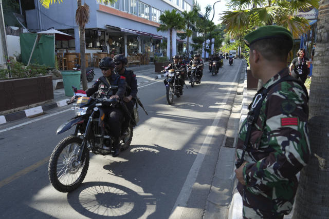 Indonesian police ride motor bike during a patrol on a street in Labuan Bajo, East Nusa Tenggara province, Indonesia, Monday, May 8, 2023. Indonesian President Joko Widodo will host fellow leaders of the Association of Southeast Asian Nations this week in their annual summit in Labuan Bajo. (AP Photo/ Achmad Ibrahim)