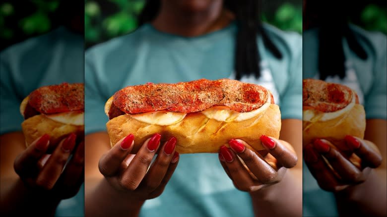 woman holding firehouse subs