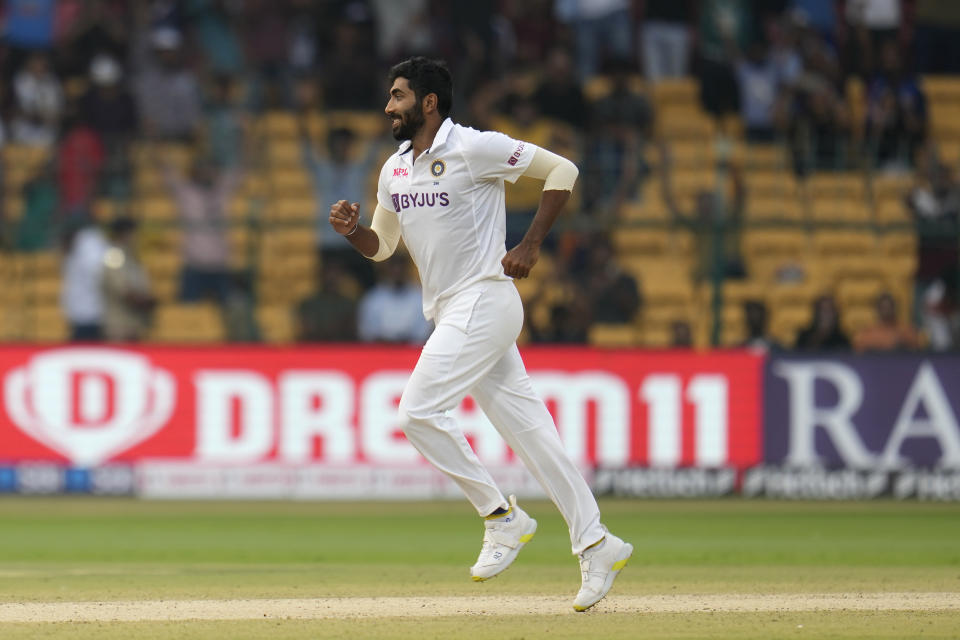 India's Jasprit Bumrah celebrates the dismissal of Sri Lanka's Suranga Lakmal during the third day of the second cricket test match between India and Sri Lanka in Bengaluru, India, Monday, March 14, 2022. (AP Photo/Aijaz Rahi)