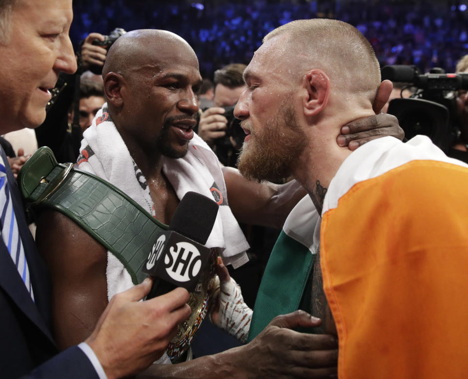 <p>Floyd Mayweather Jr., left, embraces Conor McGregor after a super welterweight boxing match Saturday, Aug. 26, 2017, in Las Vegas. (AP Photo/Isaac Brekken) </p>