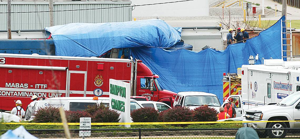 A large blue tarp covered the destroyed engine of a Dakota Minnesota & Eastern Railroad freight train as authorities investigated the cause of the 2009 wreck in Bettendorf, Iowa. The crash killed the conductor, Andrew Reed, and the engineer.