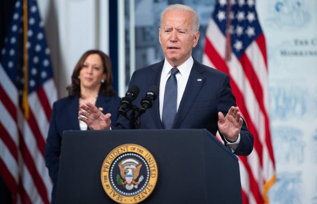 US President Joe Biden, with Vice President Kamala Harris (L), speaks about the Child Tax Credit relief payments that are part of the American Rescue Plan during an event in the Eisenhower Executive Office Building in Washington, DC, July 15, 2021. (Photo by SAUL LOEB / AFP) (Photo by SAUL LOEB/AFP via Getty Images)