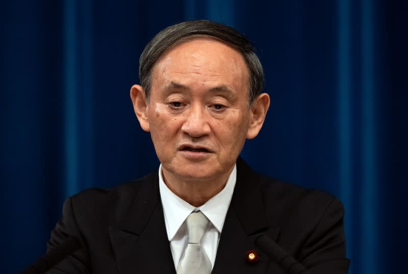 Yoshihide Suga speaks during a news conference following his confirmation as Prime Minister of Japan in Tokyo