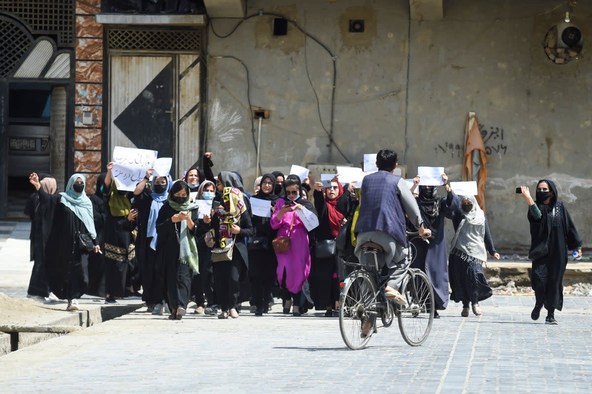 Afghan women hold placards as they march to protest for their rights, in Kabul (AFP/Getty)