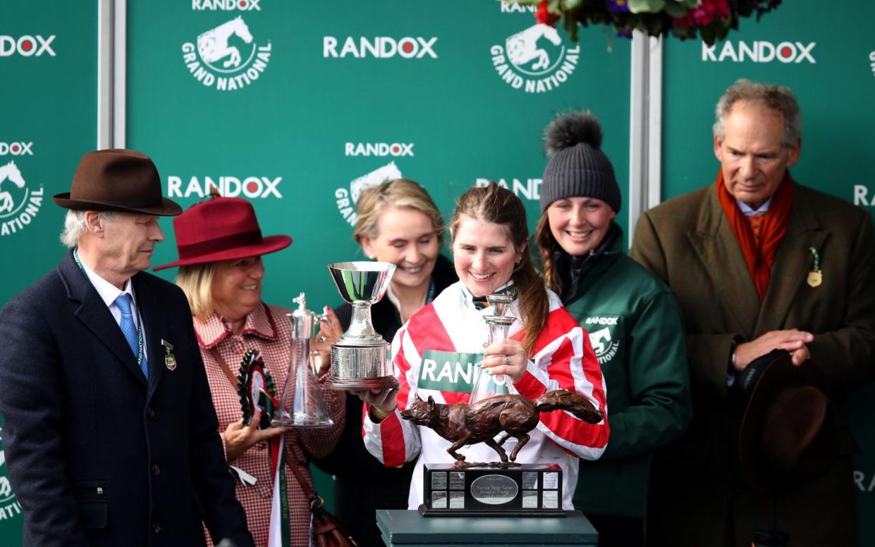 Gina Andrews (centre) after riding Latenightpass to victory at Aintree in 2022