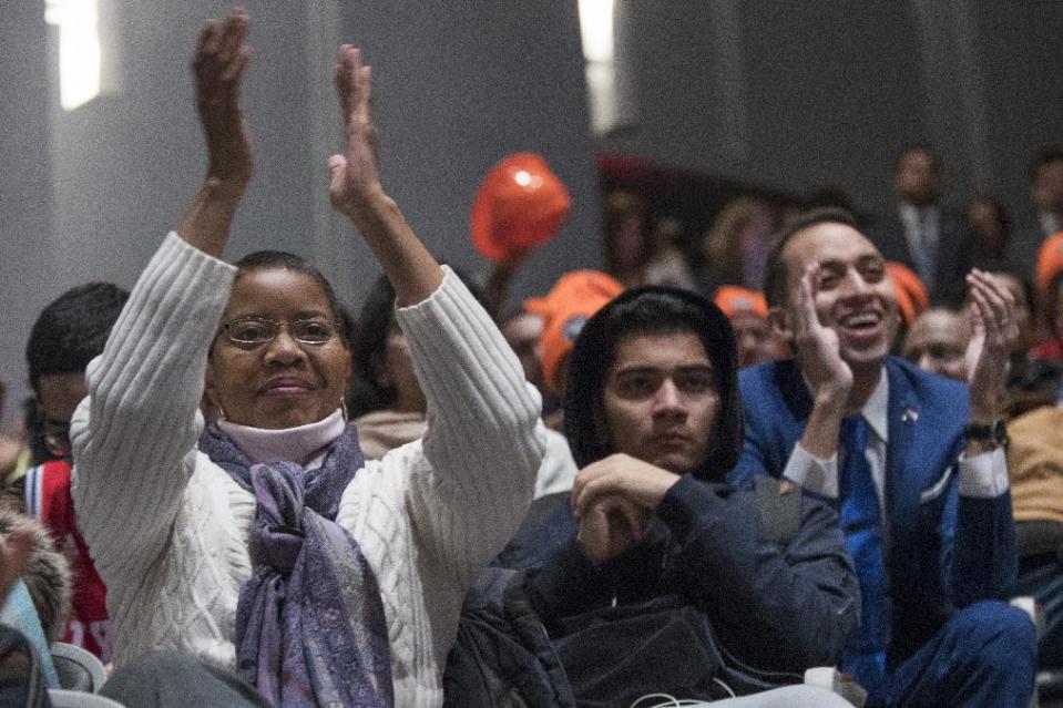 Students and faculty applaud during an event with Vermont Sen. Bernie Sanders, New York Gov. Andrew Cuomo, and Chairperson of the Board of Trustees of The City University of New York William C. Thompson, at LaGuardia Community College, Tuesday, Jan. 3, 2017, in New York. Gov. Cuomo announced a proposal for free tuition at state colleges to hundreds of thousands of low- and middle income residents. Under the governor's plan, which requires legislative approval, any college student accepted to a New York public university or two-year community college is eligible, provided their family earns less than $125,000. (AP Photo/Mary Altaffer)