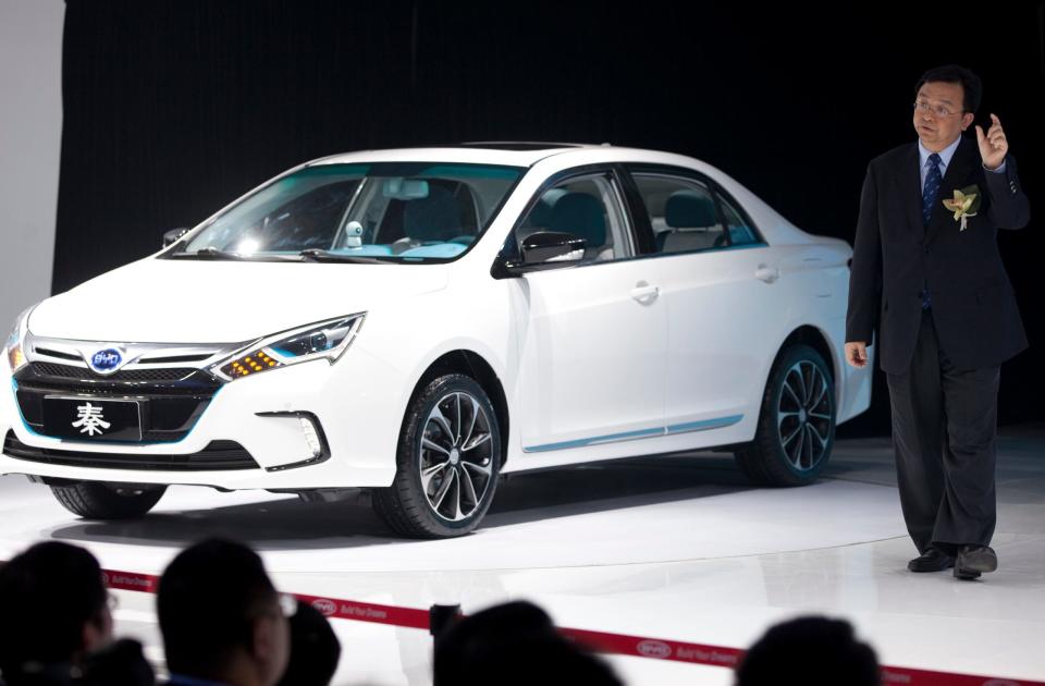 Wang Chuanfu, founder and chairman of Chinese automaker BYD Co., introduces the BYD Qin at the Beijing International Auto Exhibition in Beijing, China, Monday, April 23, 2012.