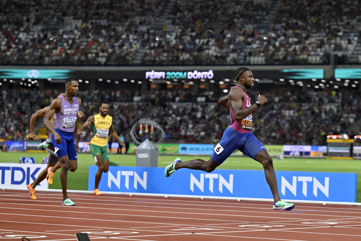 Noah Lyles, of the United States, leads the pack to win the Men's 200-meters final during the World Athletics Championships in Budapest, Hungary, Friday, Aug. 25, 2023. (AP Photo/Denes Erdos)