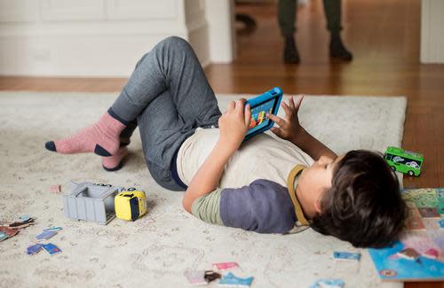 Boy using Kindle Fire in case